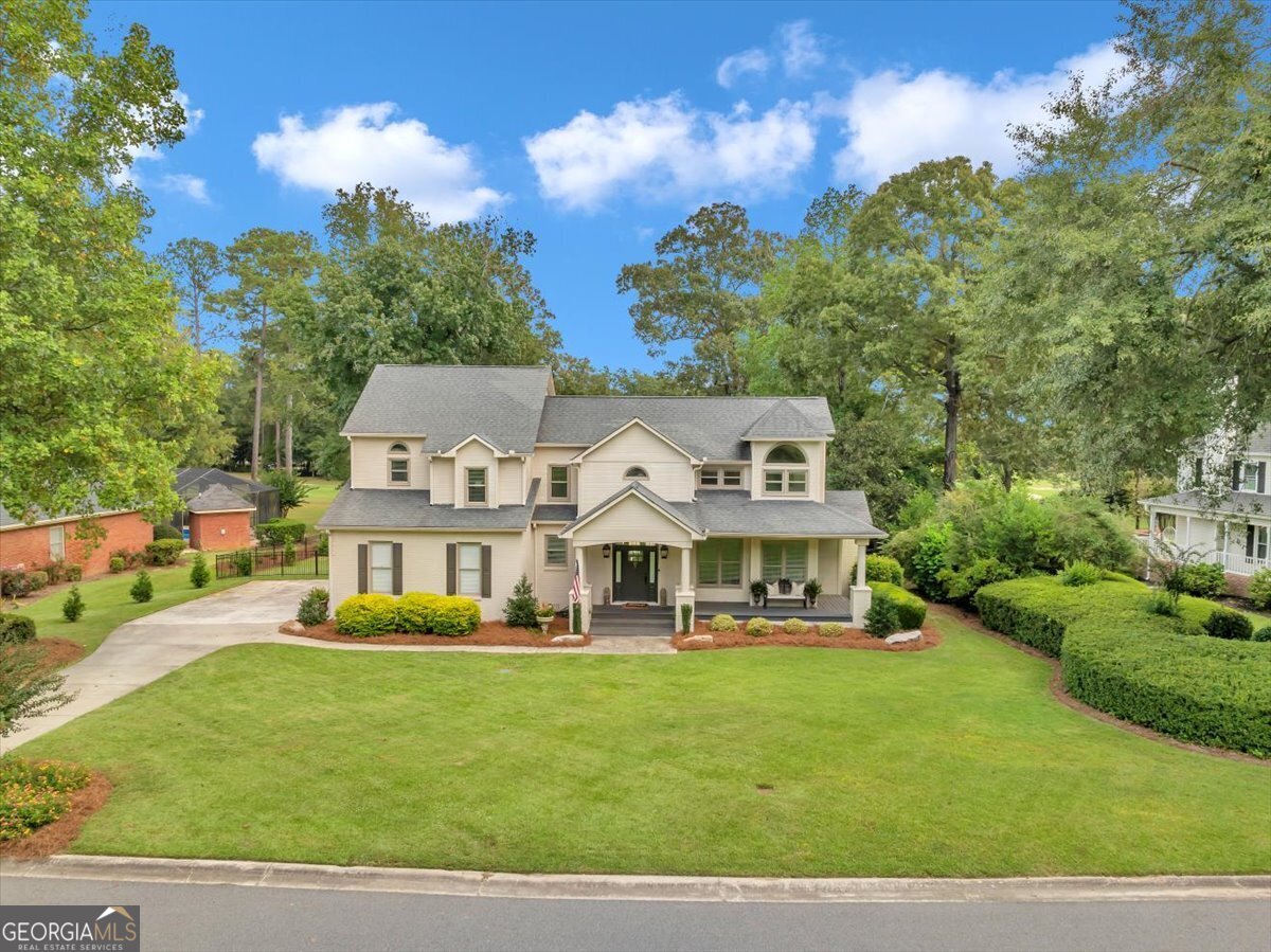 a view of a house with a big yard