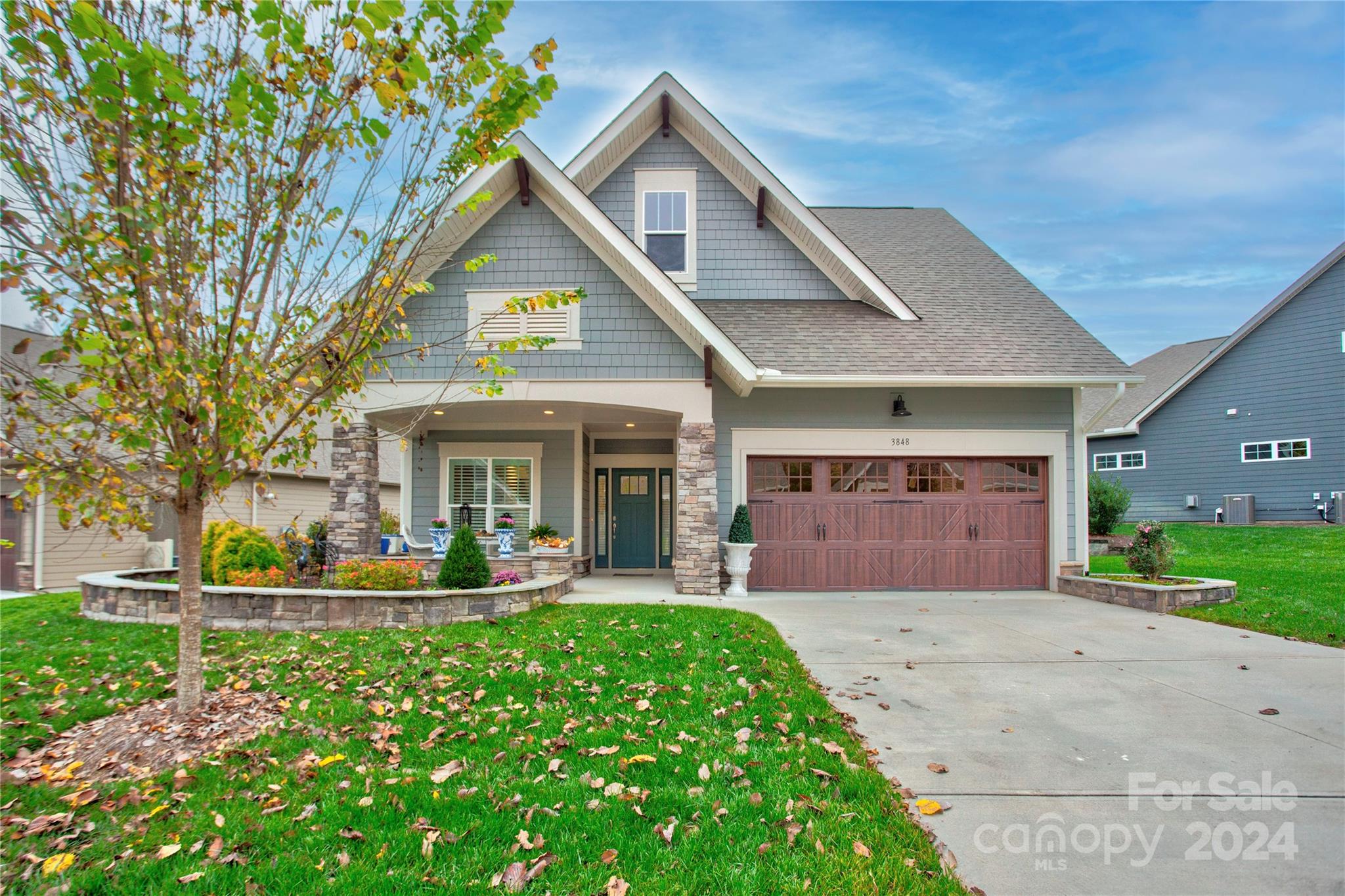 a front view of a house with a yard and porch