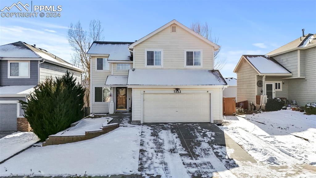 Front of property with a garage