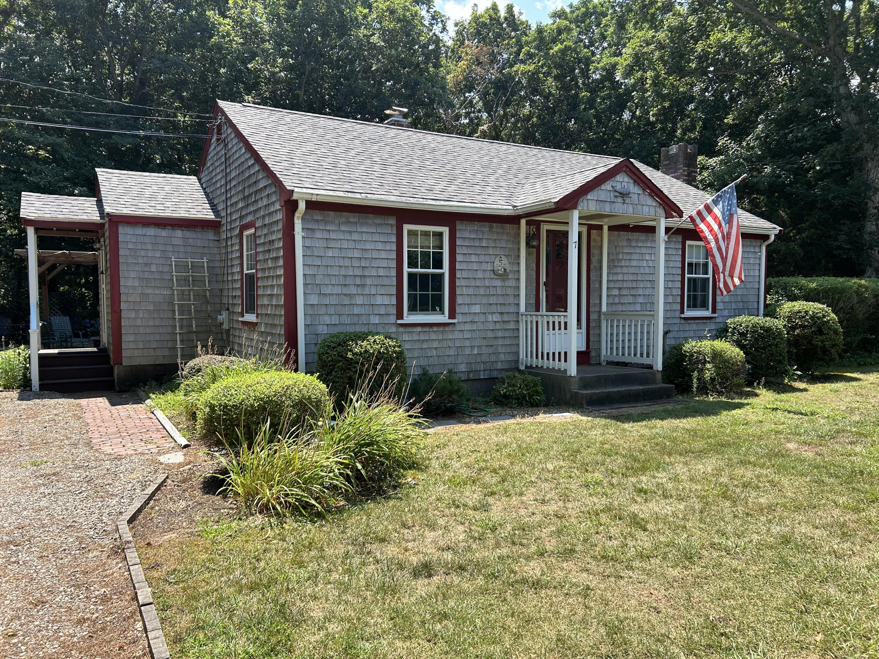 a front view of a house with garden