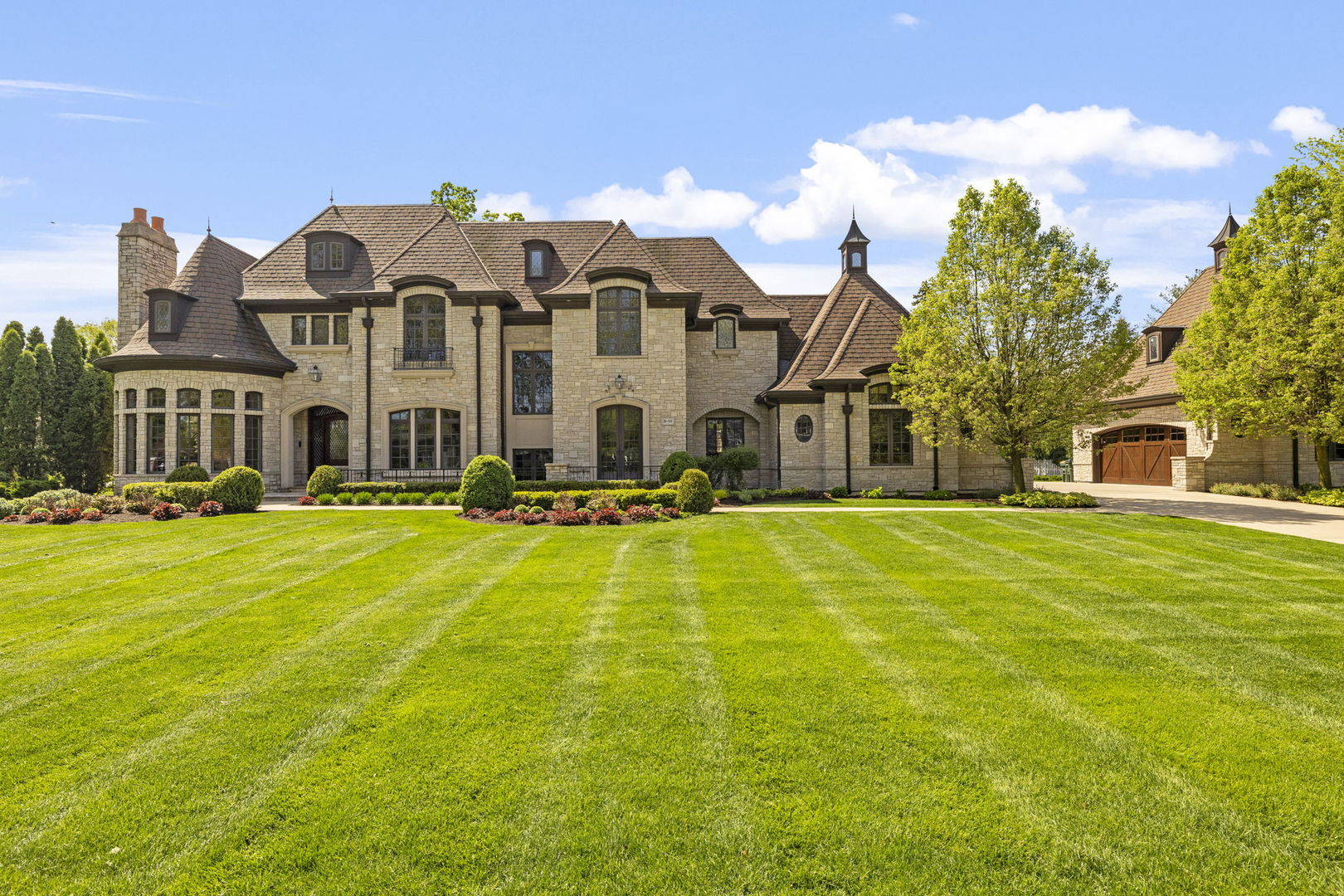 a front view of a house with swimming pool yard and outdoor seating