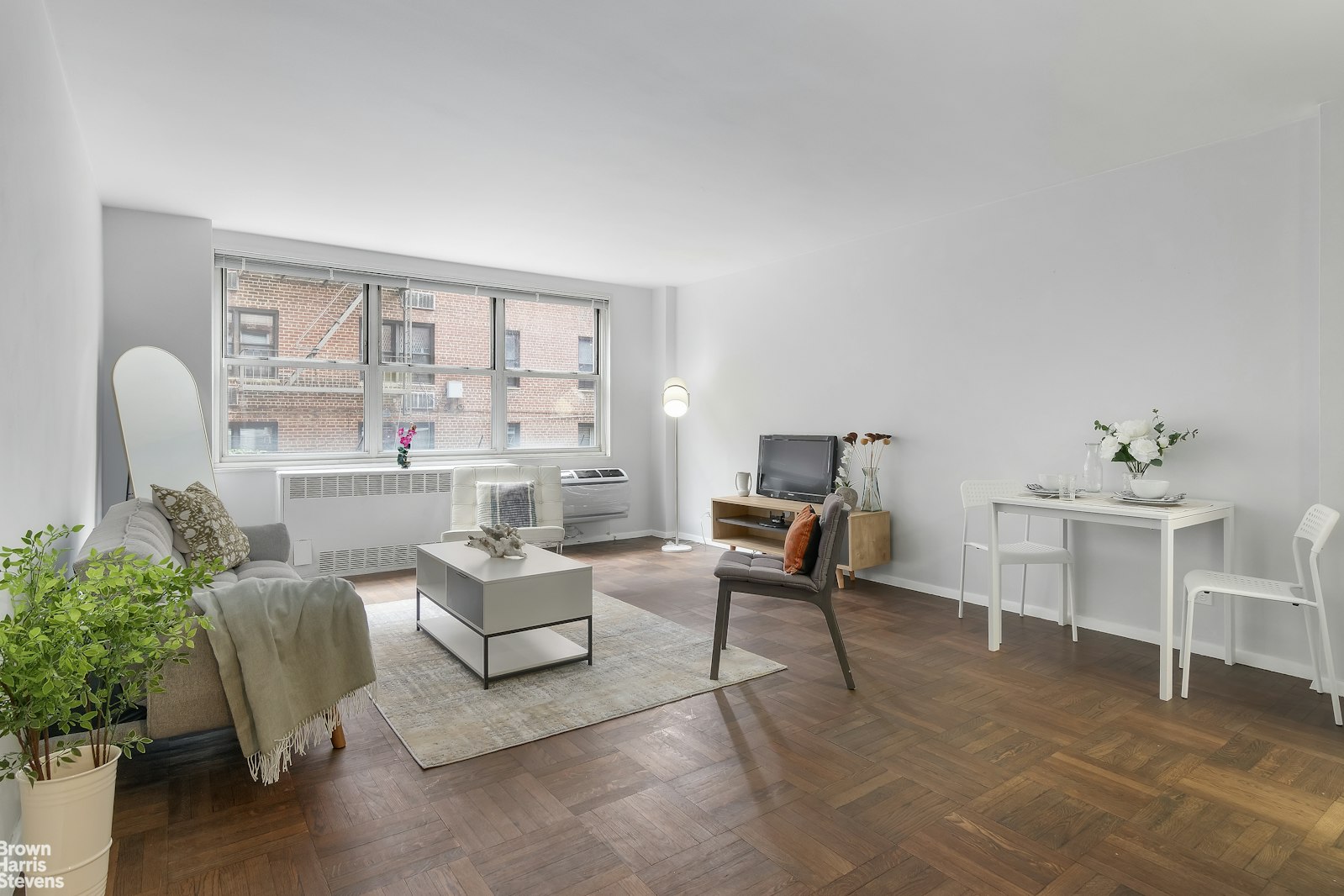 a living room with furniture and a window