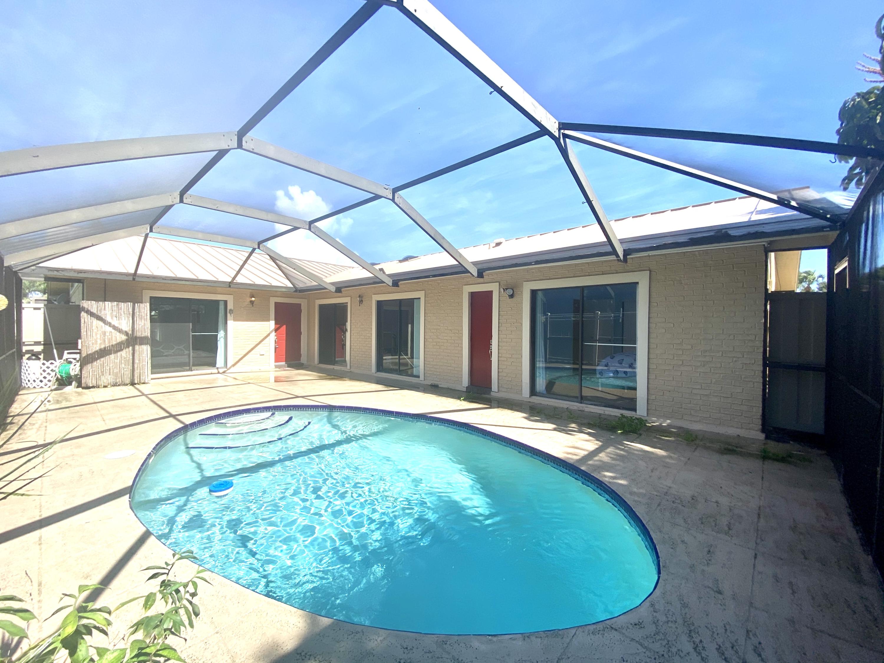 a view of a house with swimming pool