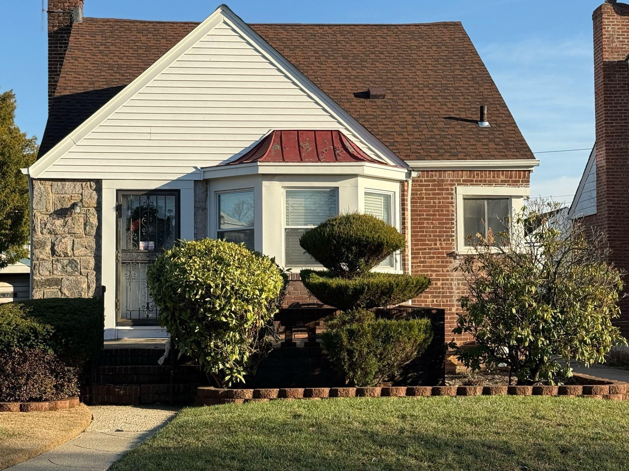 View of front of property with a front lawn