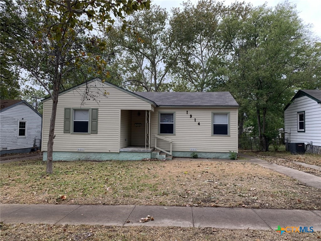 a house with trees in the background