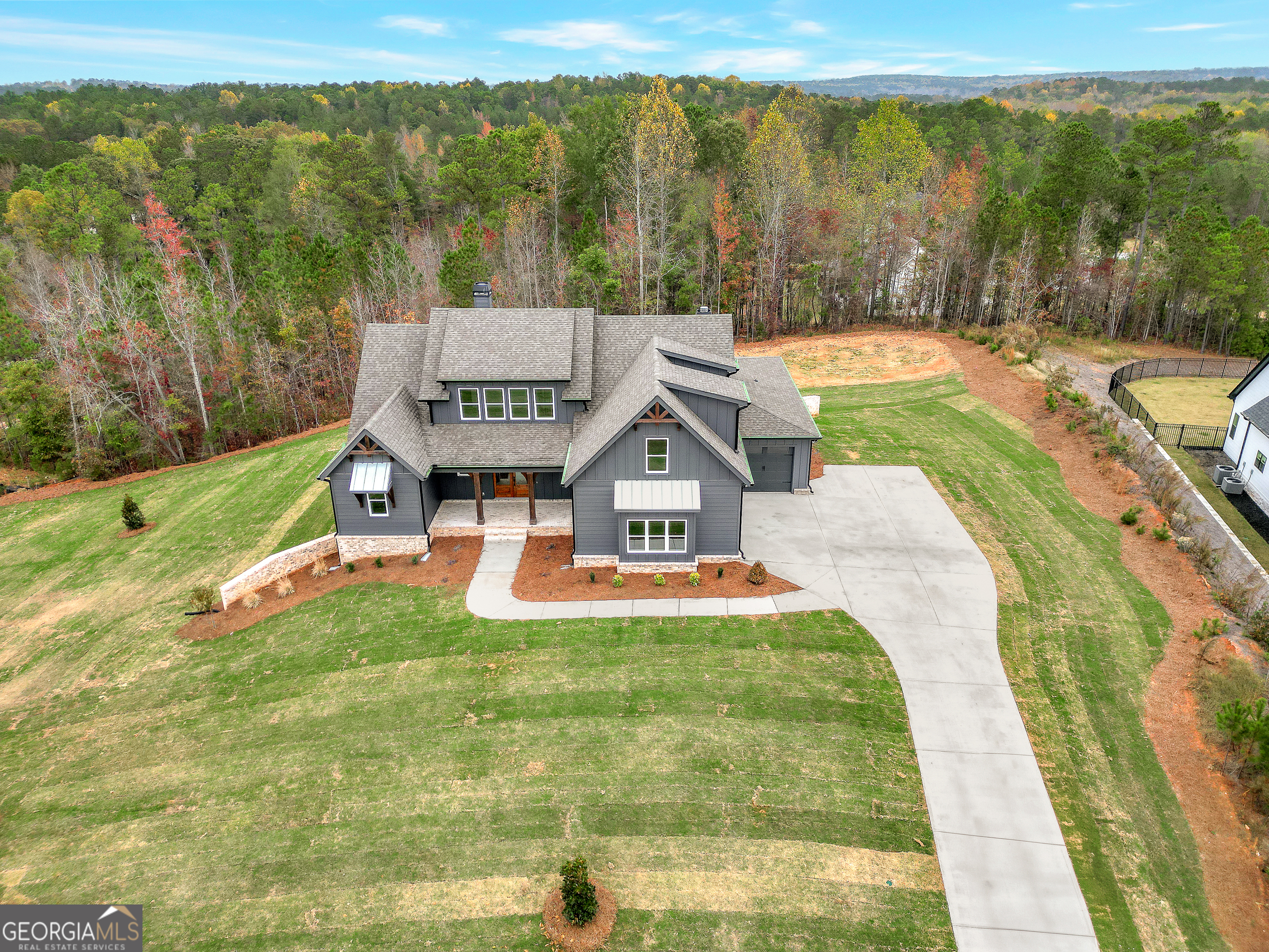 a view of a house with a big yard