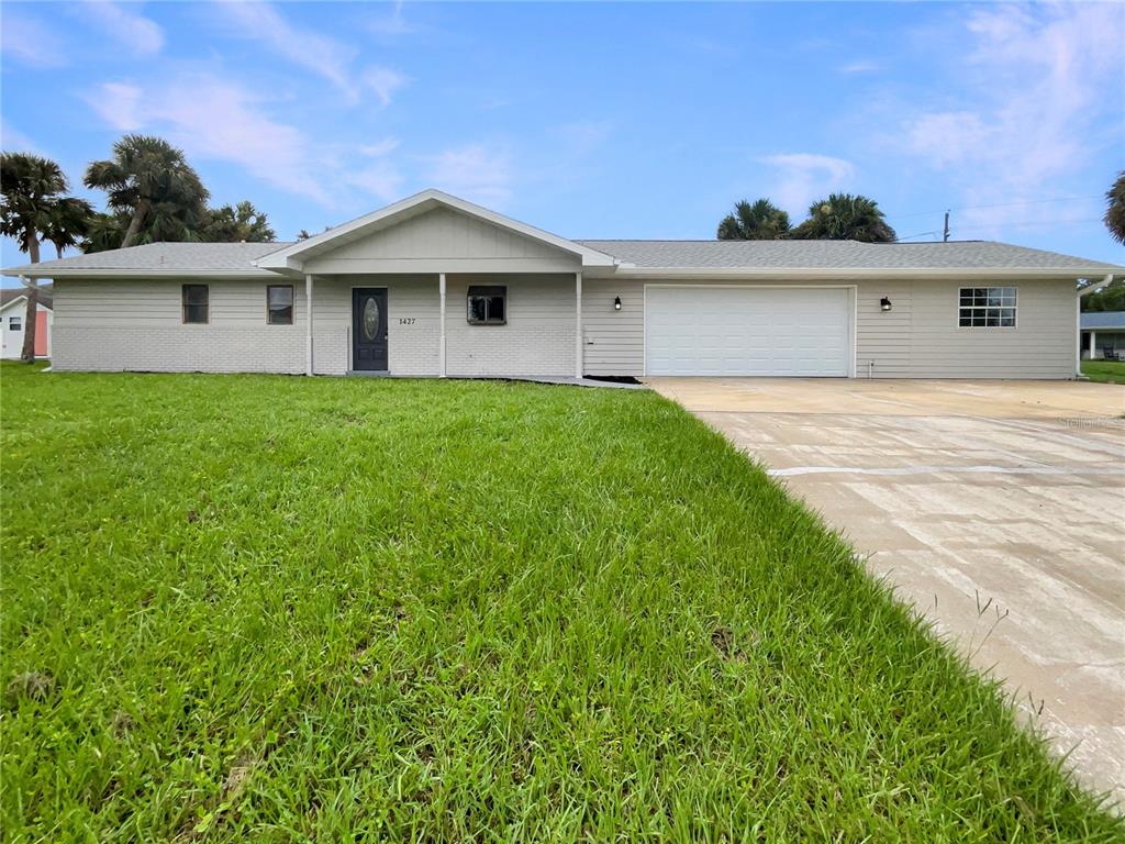 front view of a house with a yard