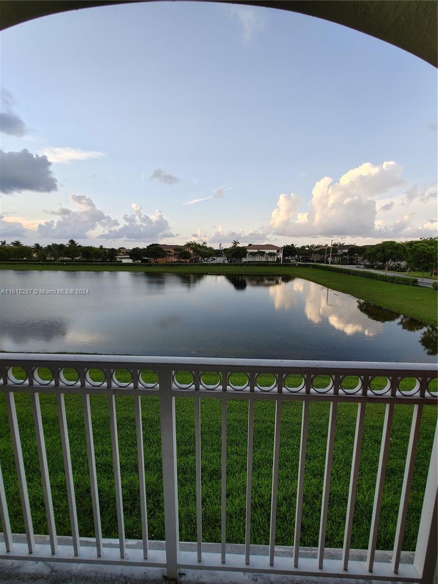 a view of a lake from a balcony