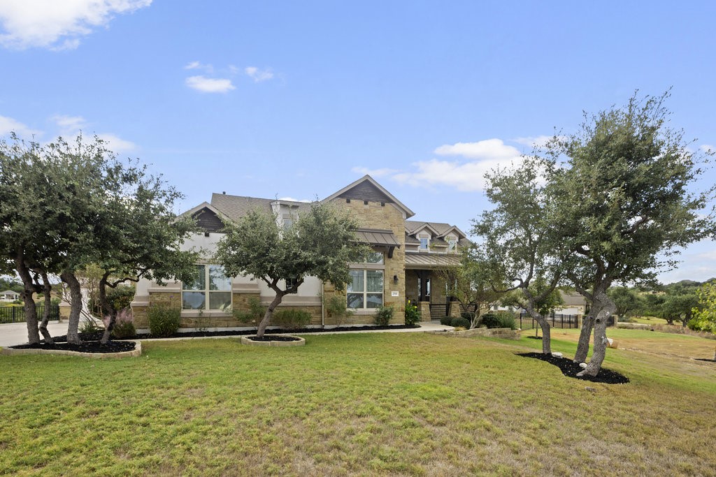 a view of a house with a yard