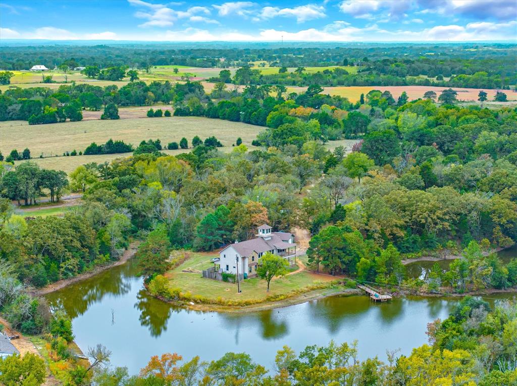 a view of a lake with a yard