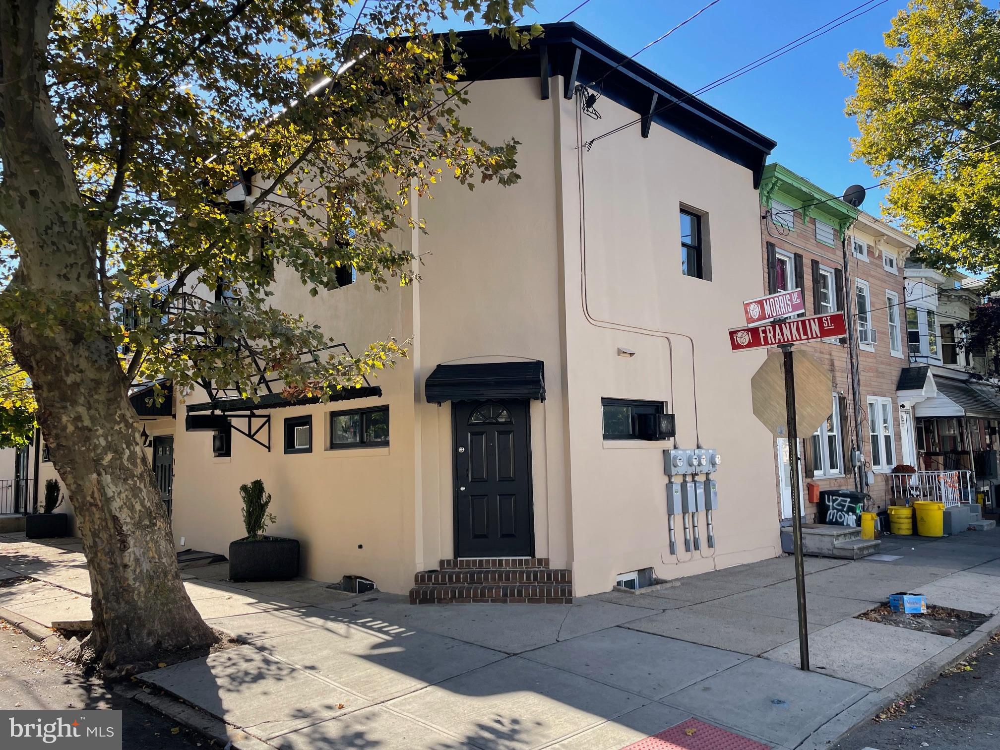 a front view of a house with street