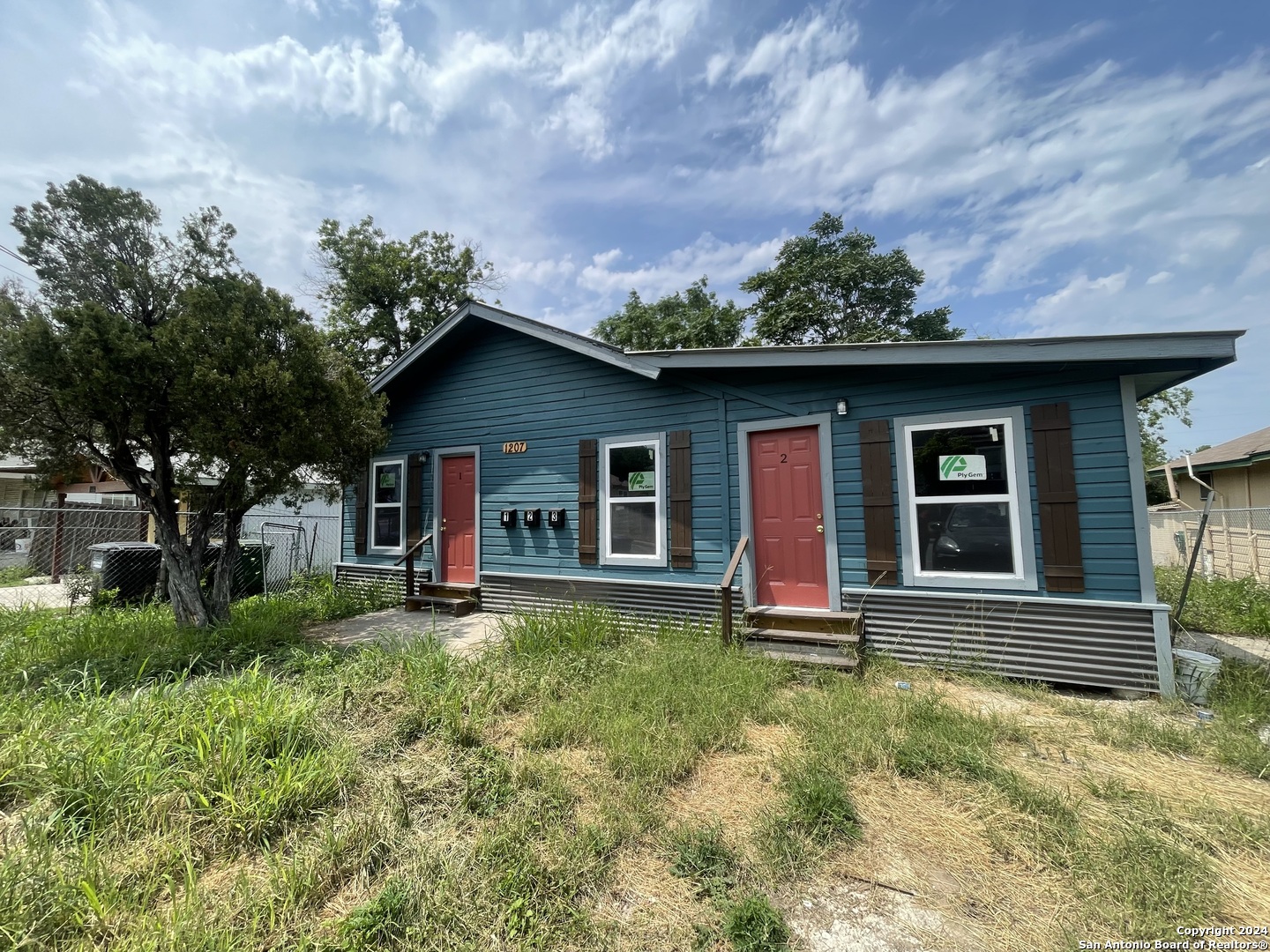 front view of a house with a yard