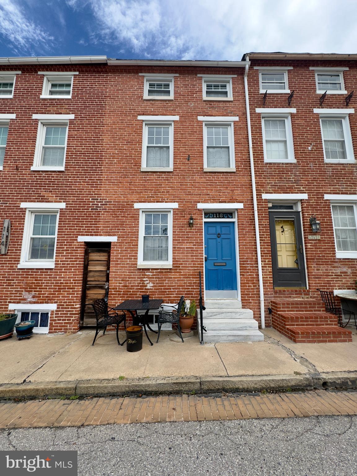 a view of a brick building with many windows