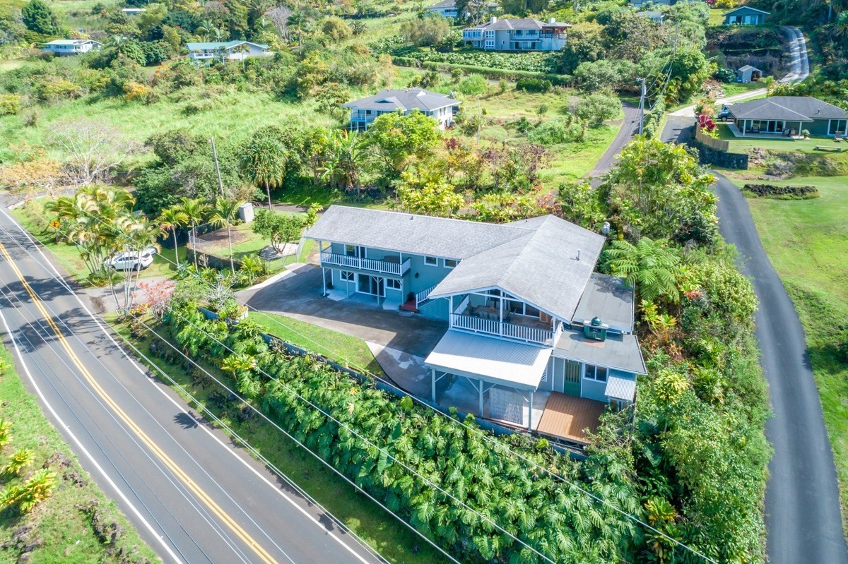 an aerial view of a house with a garden