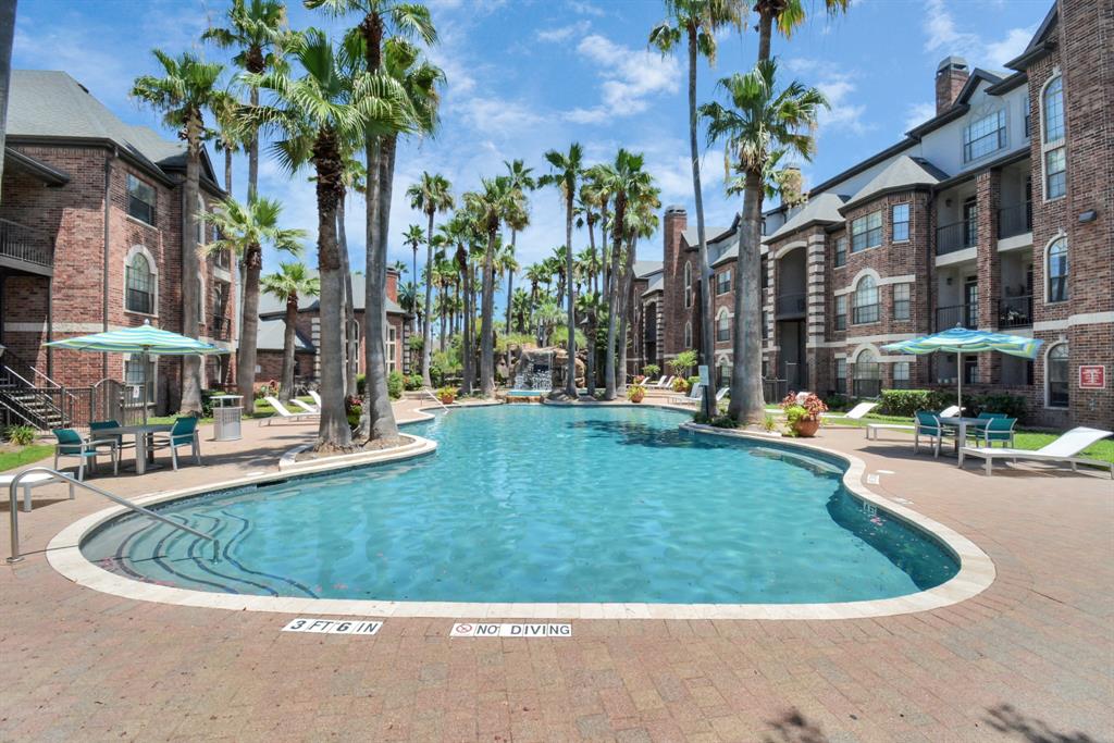 a view of swimming pool from a outdoor seating