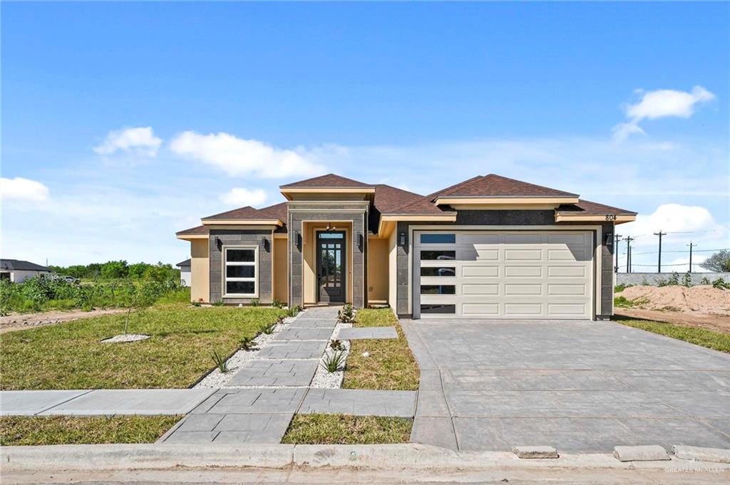 Prairie-style house with a garage