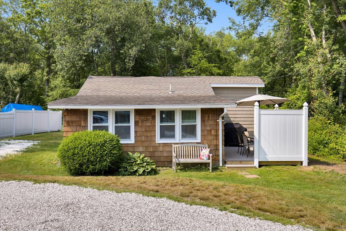 front view of a house with a yard