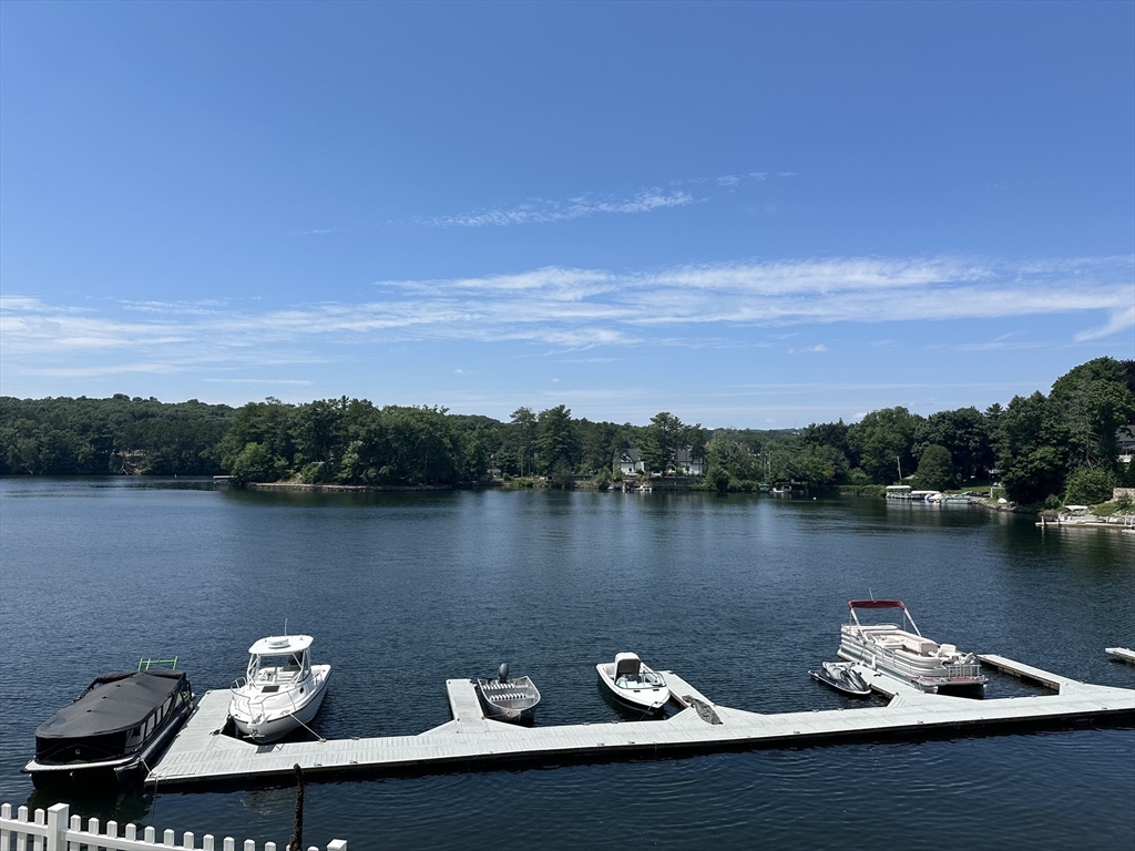 a view of a lake with outdoor seating