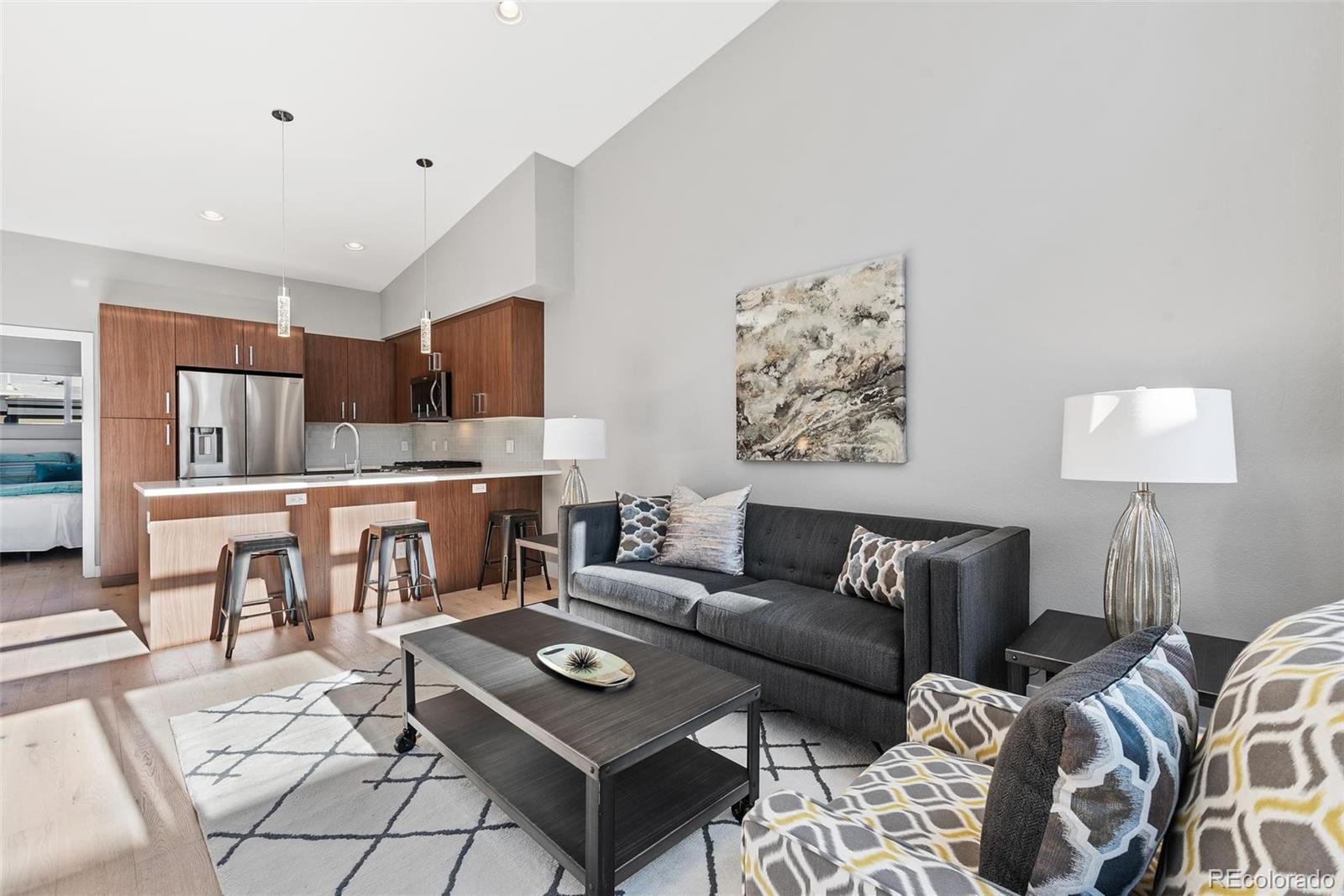 a living room with furniture and a table