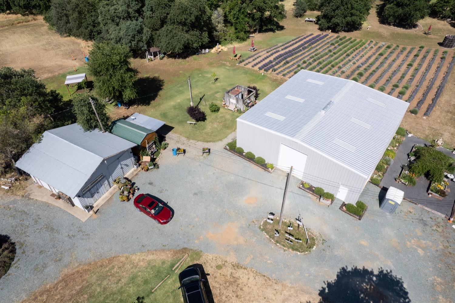 an aerial view of a house with a yard