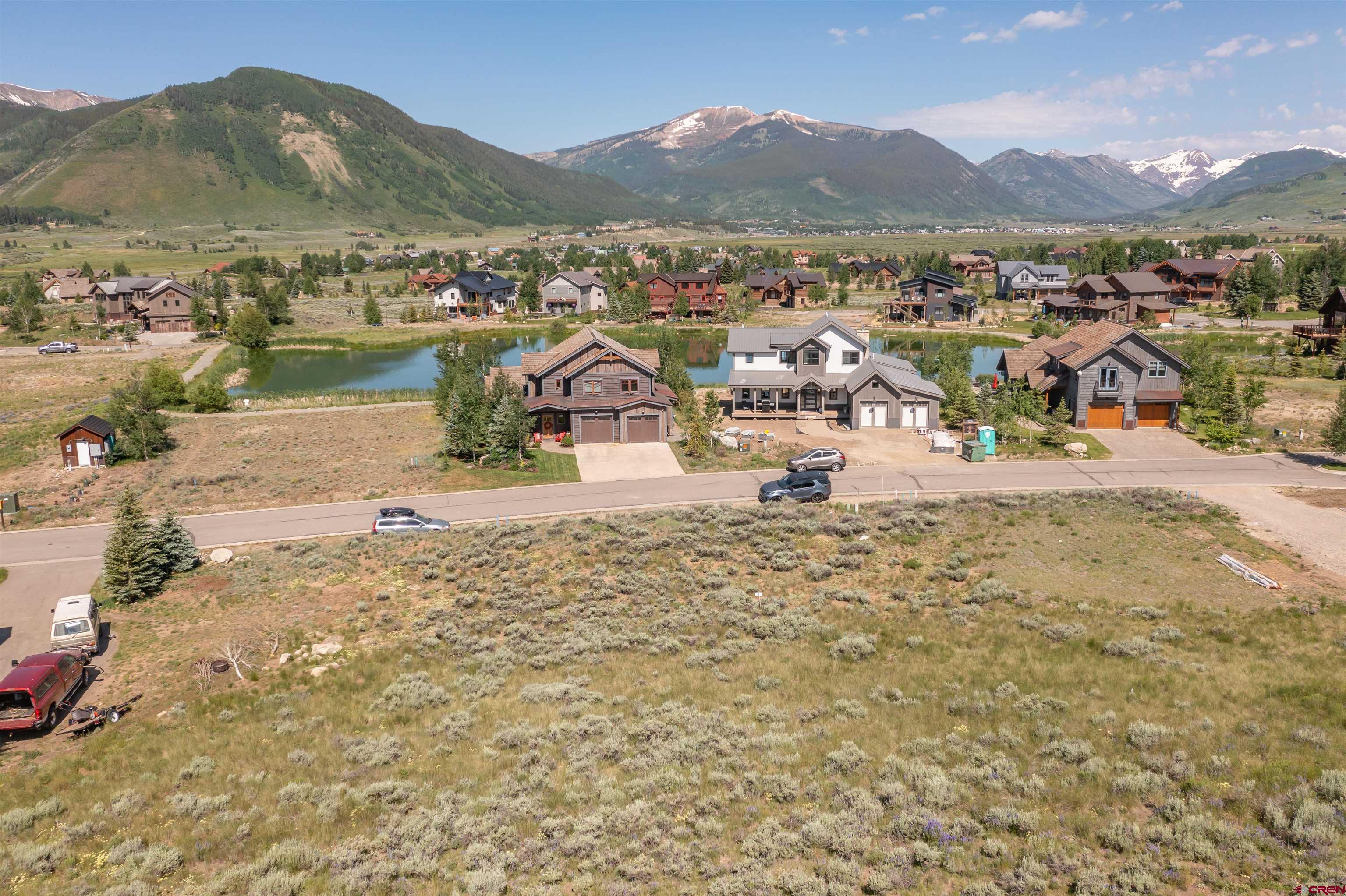 a view of a town with mountains in the background