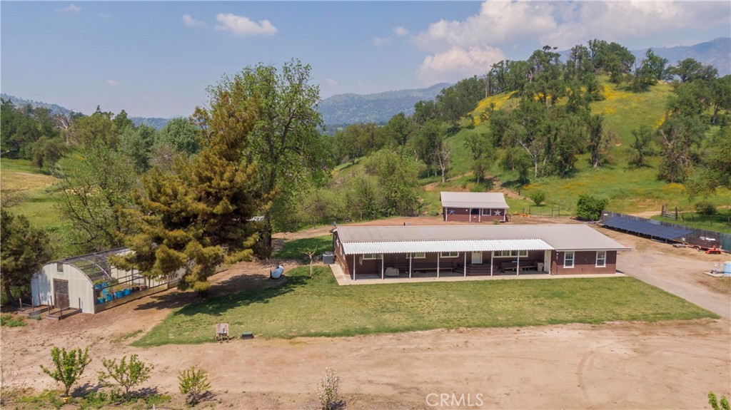 a view of a house next to a yard