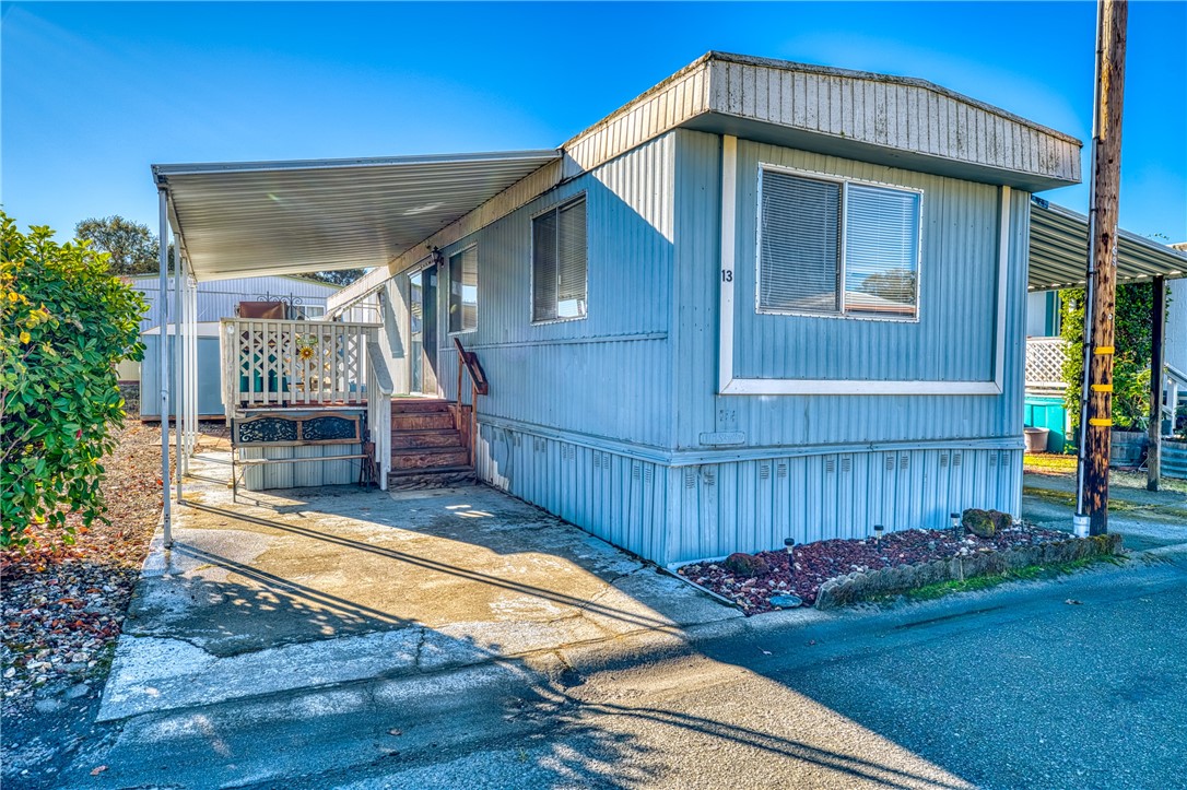 a view of a house with wooden fence