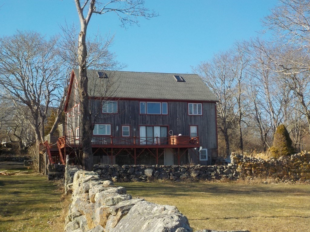 a front view of a house with a ocean view