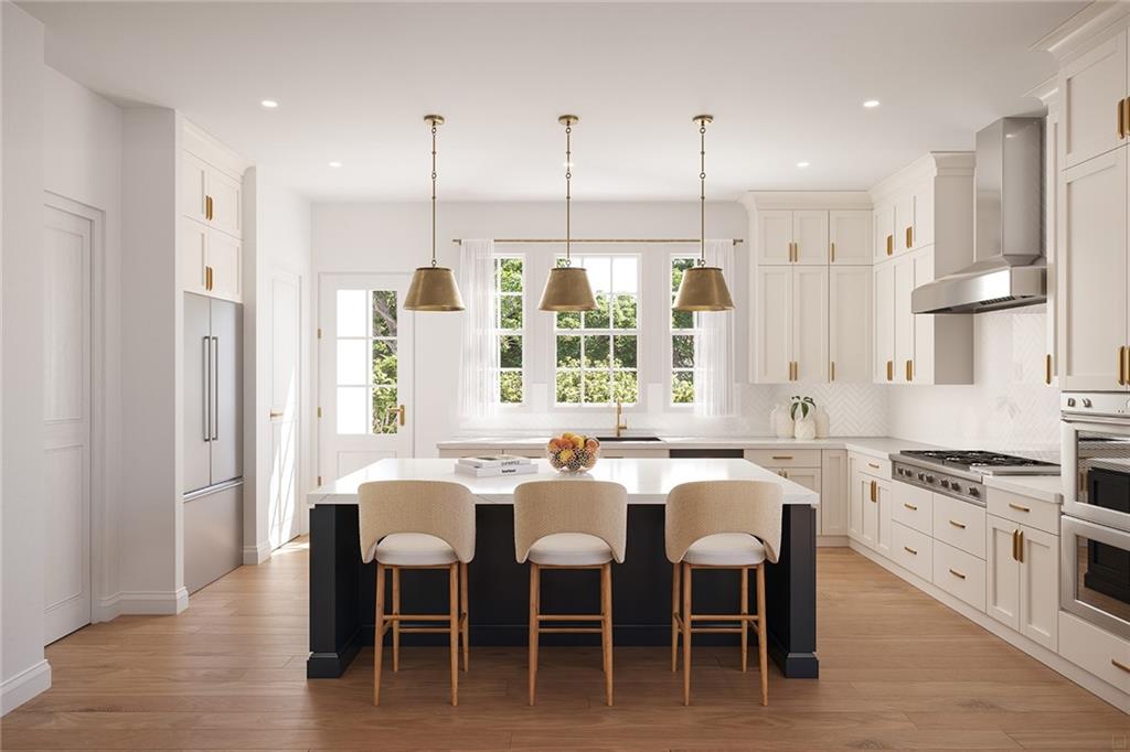 a large kitchen with a table and chairs