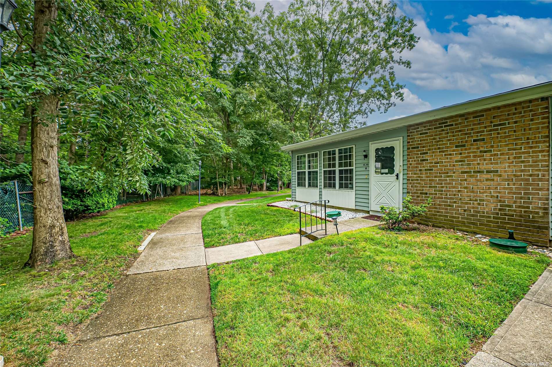 a view of a house with a backyard