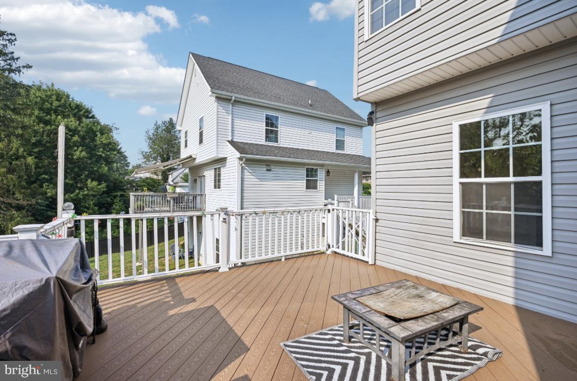 a view of a wooden deck and a yard