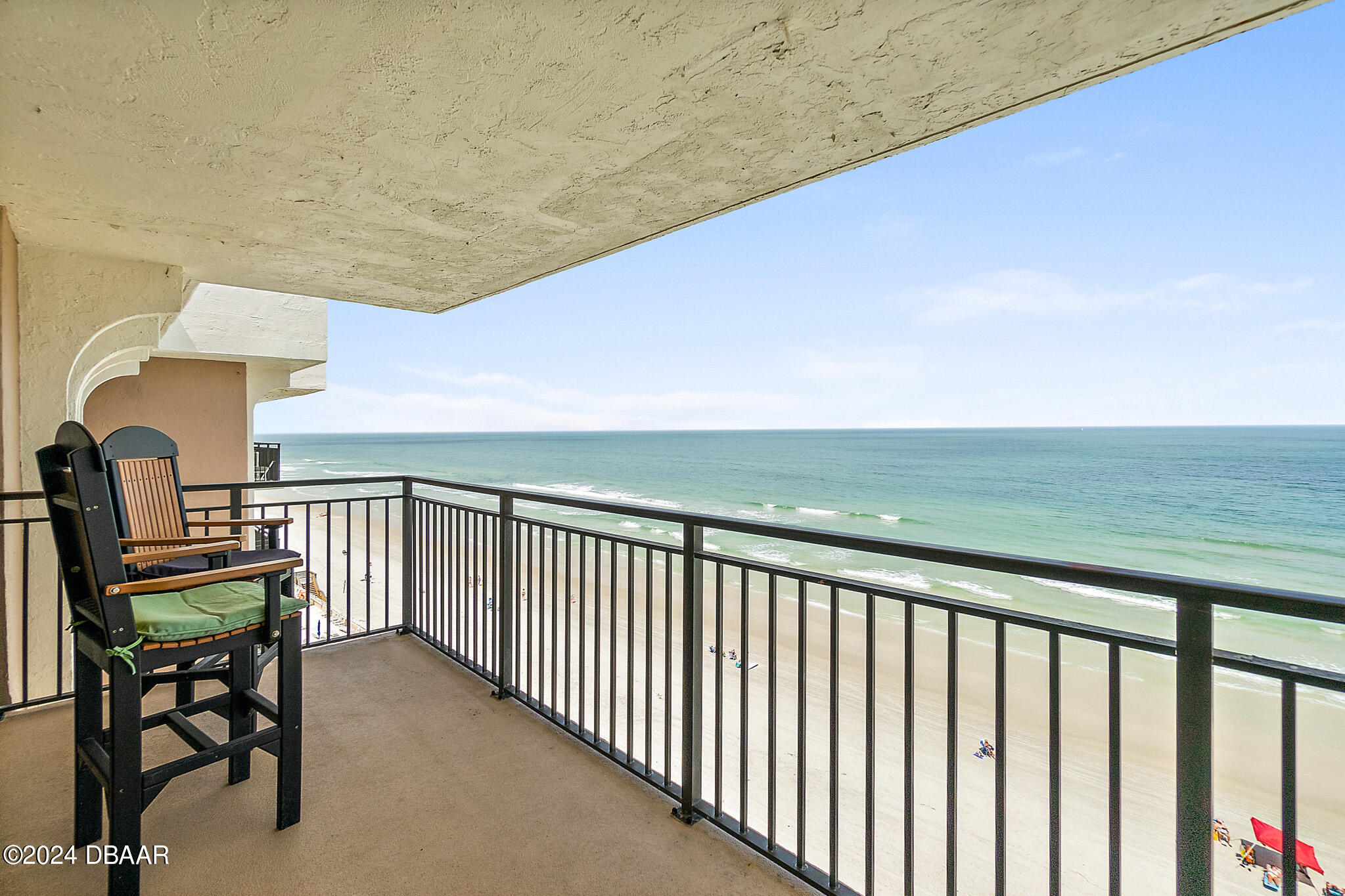 a view of a balcony with chairs