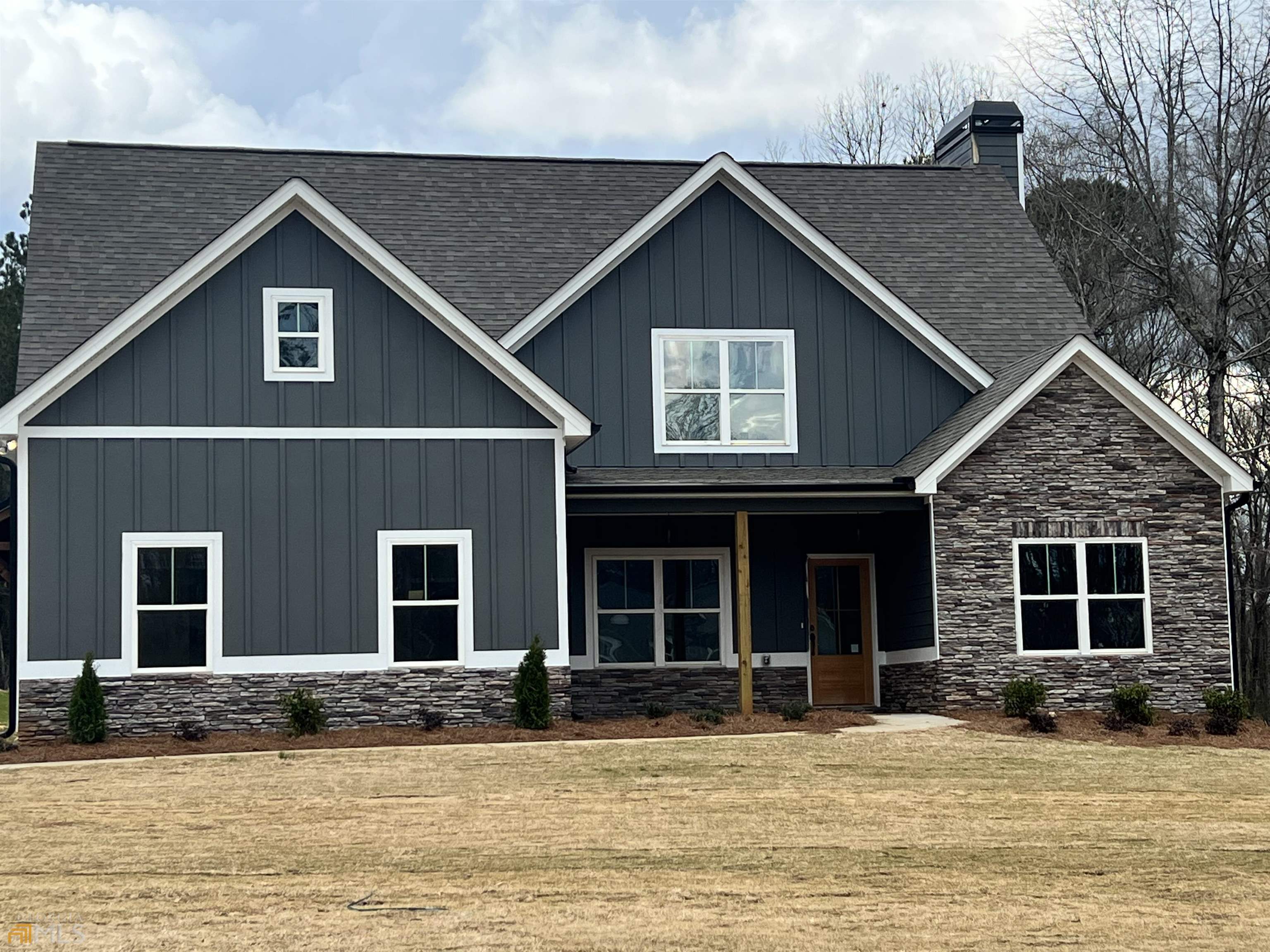 a front view of a house with a yard