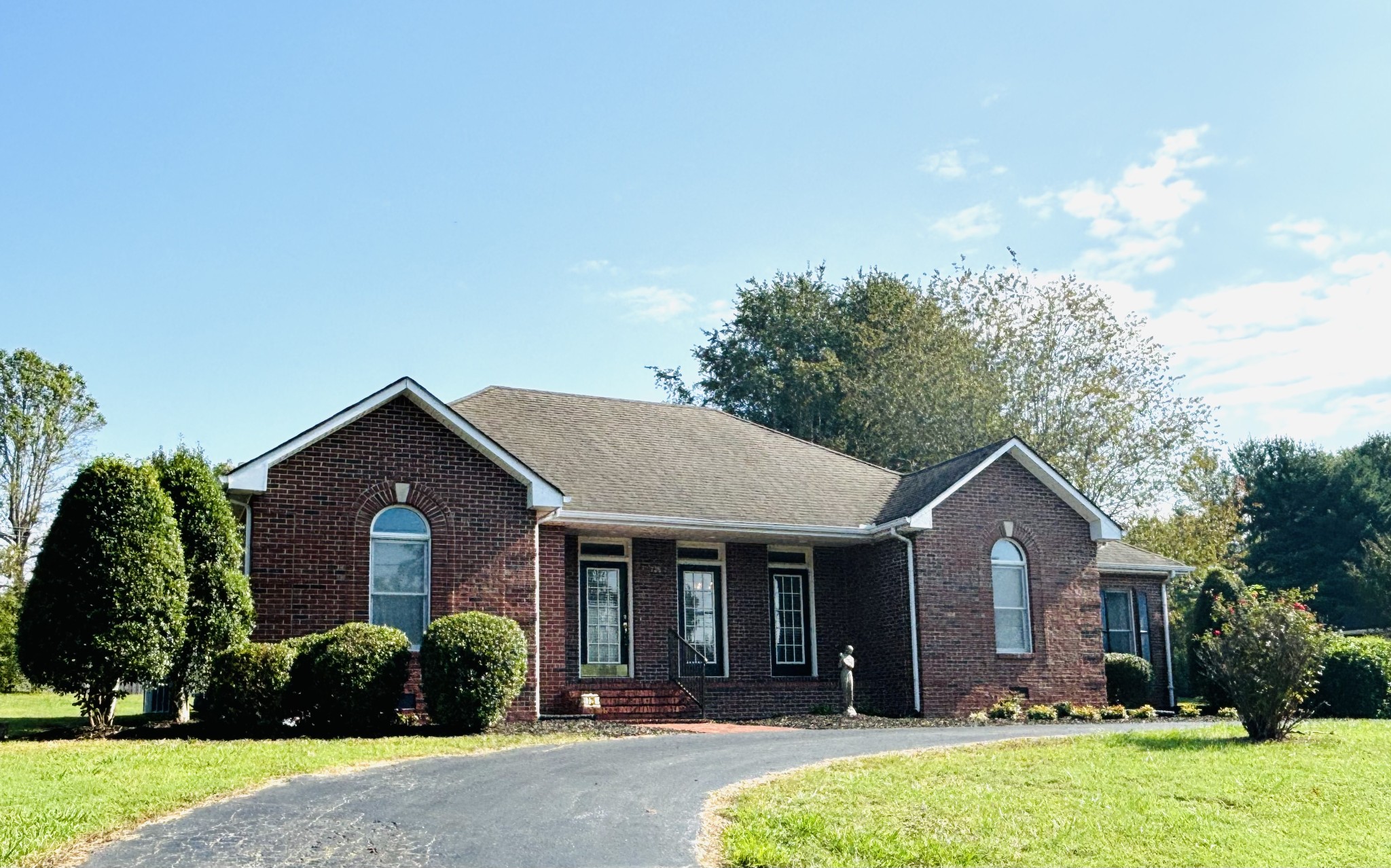 a front view of a house with a yard