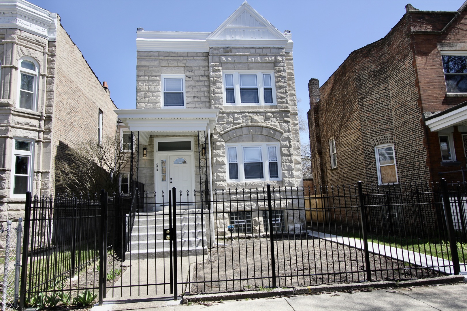 a view of a brick building with many windows