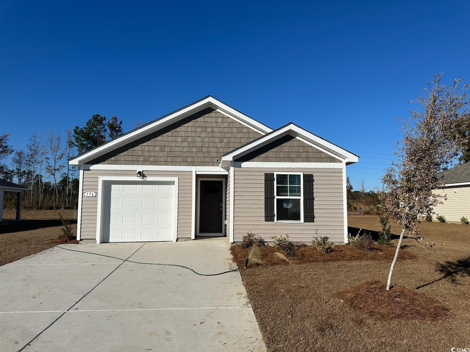 View of front of home with a garage