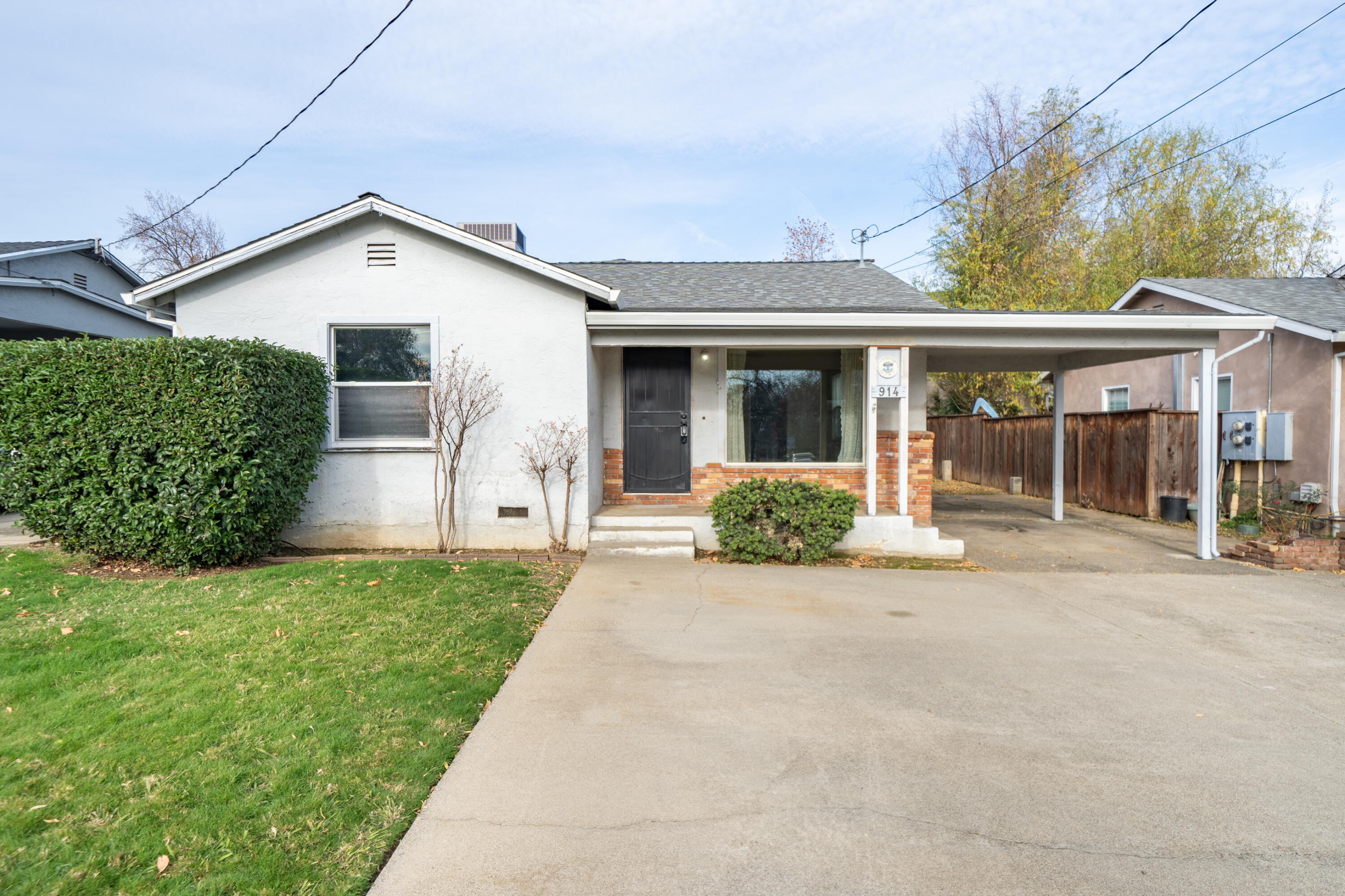 front view of a house with a yard