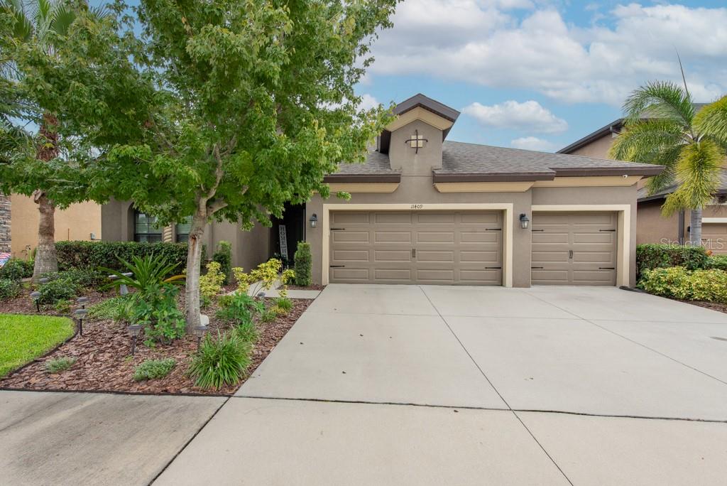 a front view of a house with a garage