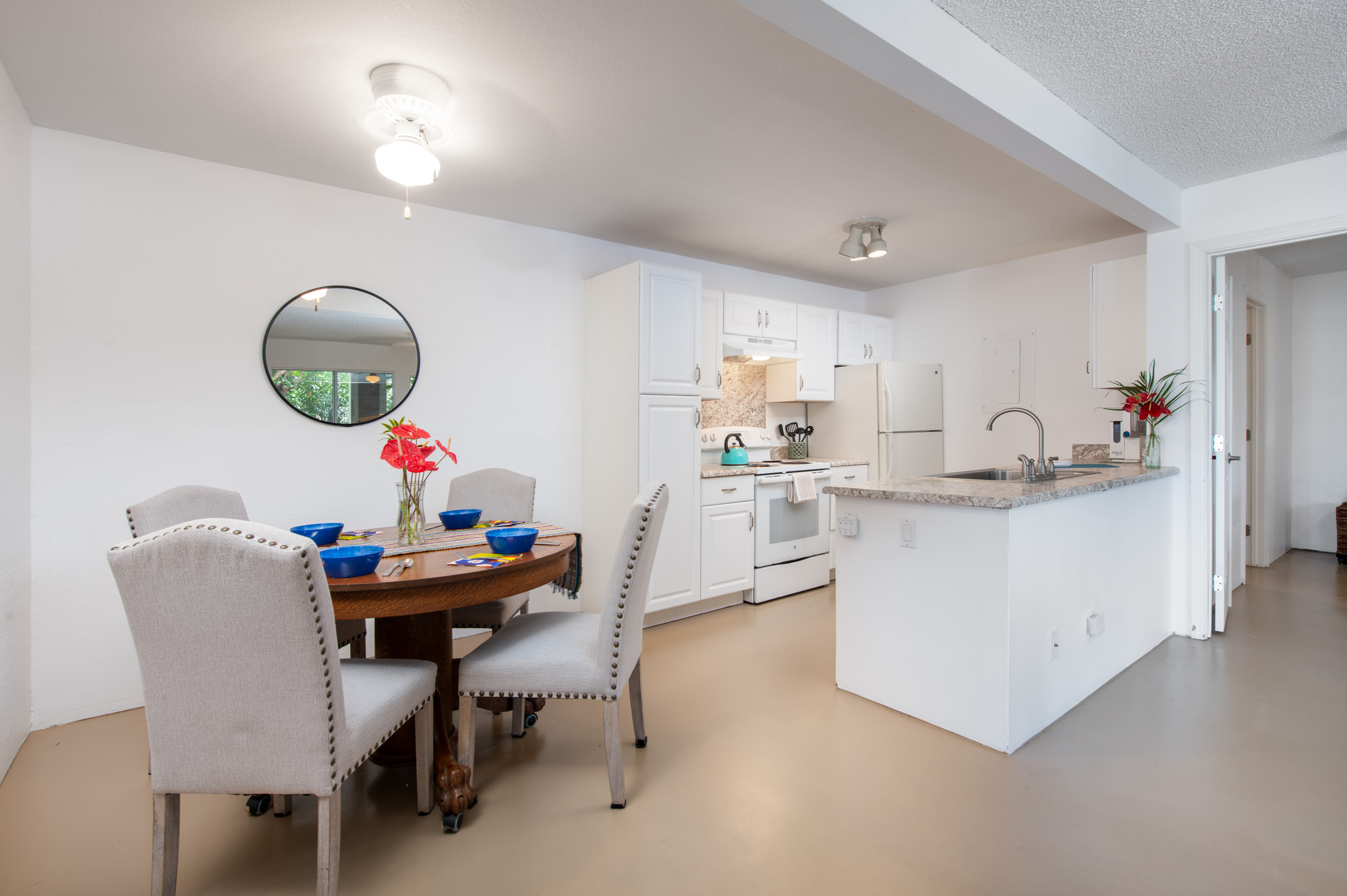 You'll love the fresh, bright upgraded cabinets in the white kitchen.