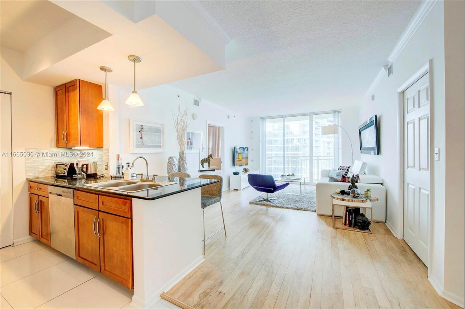 a kitchen with sink stove and cabinets