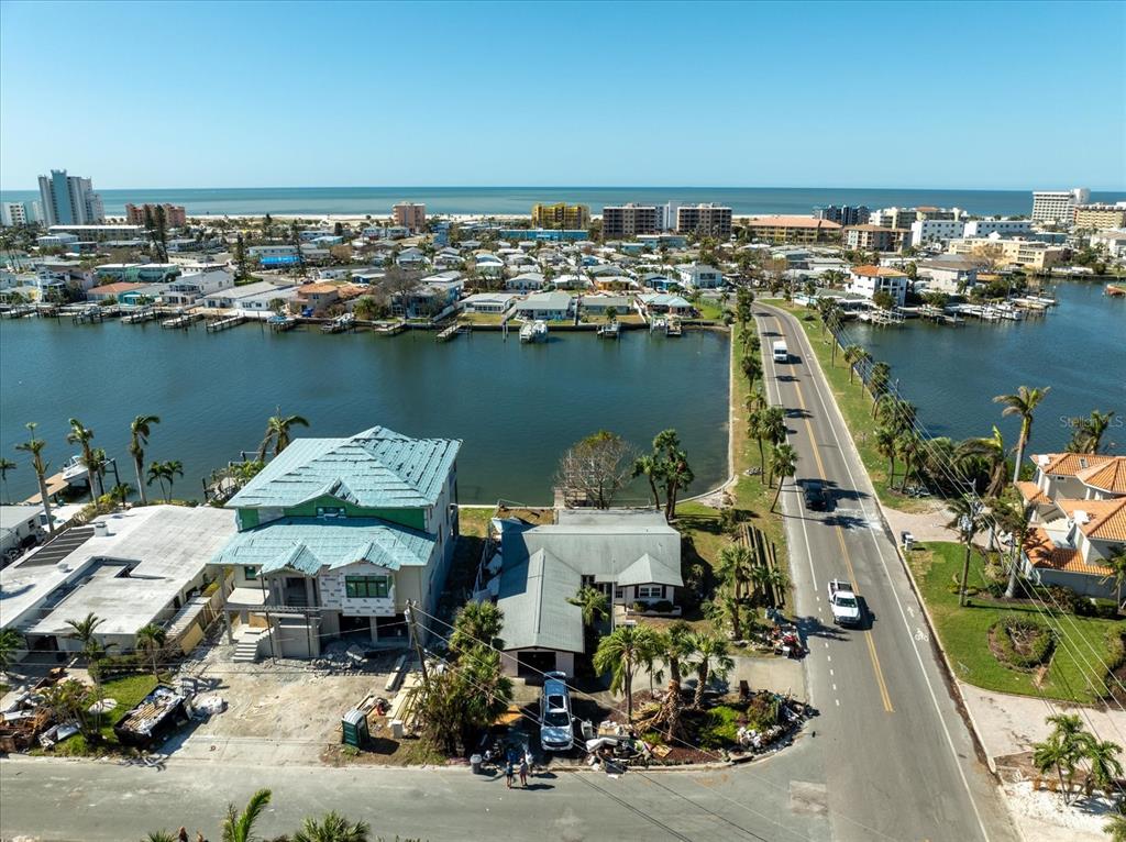 an aerial view of a house with a ocean view