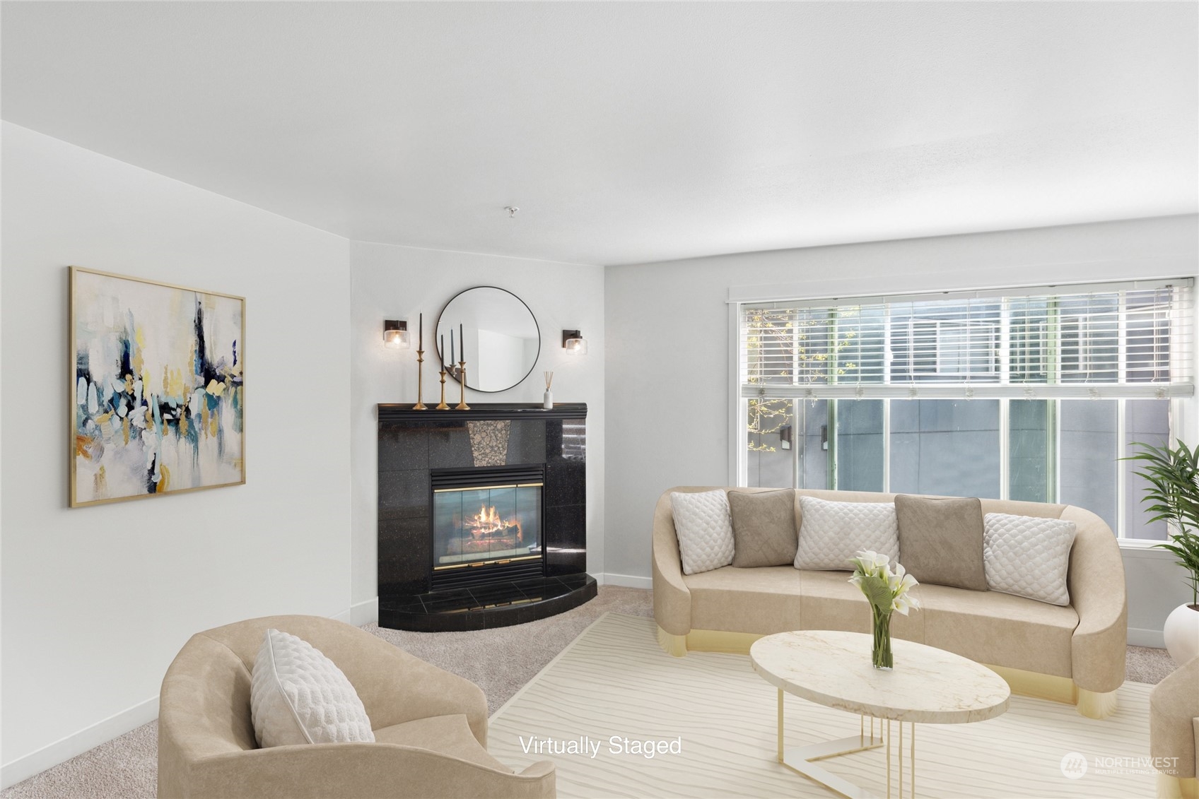 a living room with furniture a fireplace and a large window