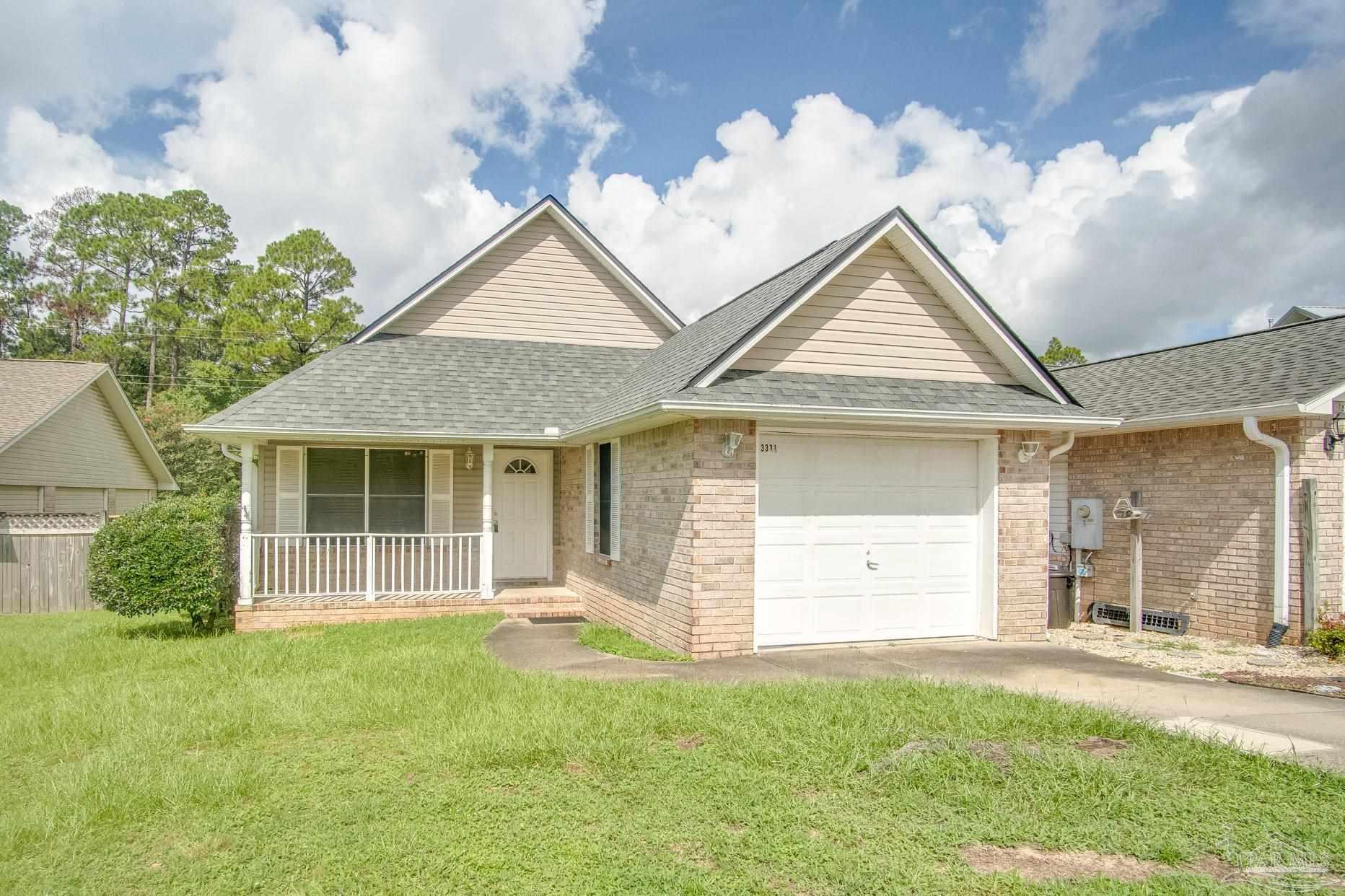 front view of a house with a yard