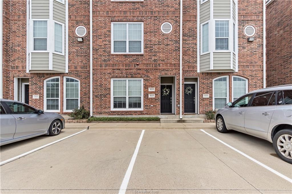 a view of a car parked in front of a building