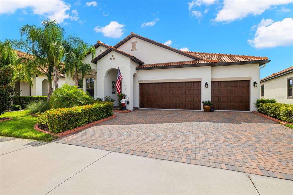 a front view of a house with a yard and garage