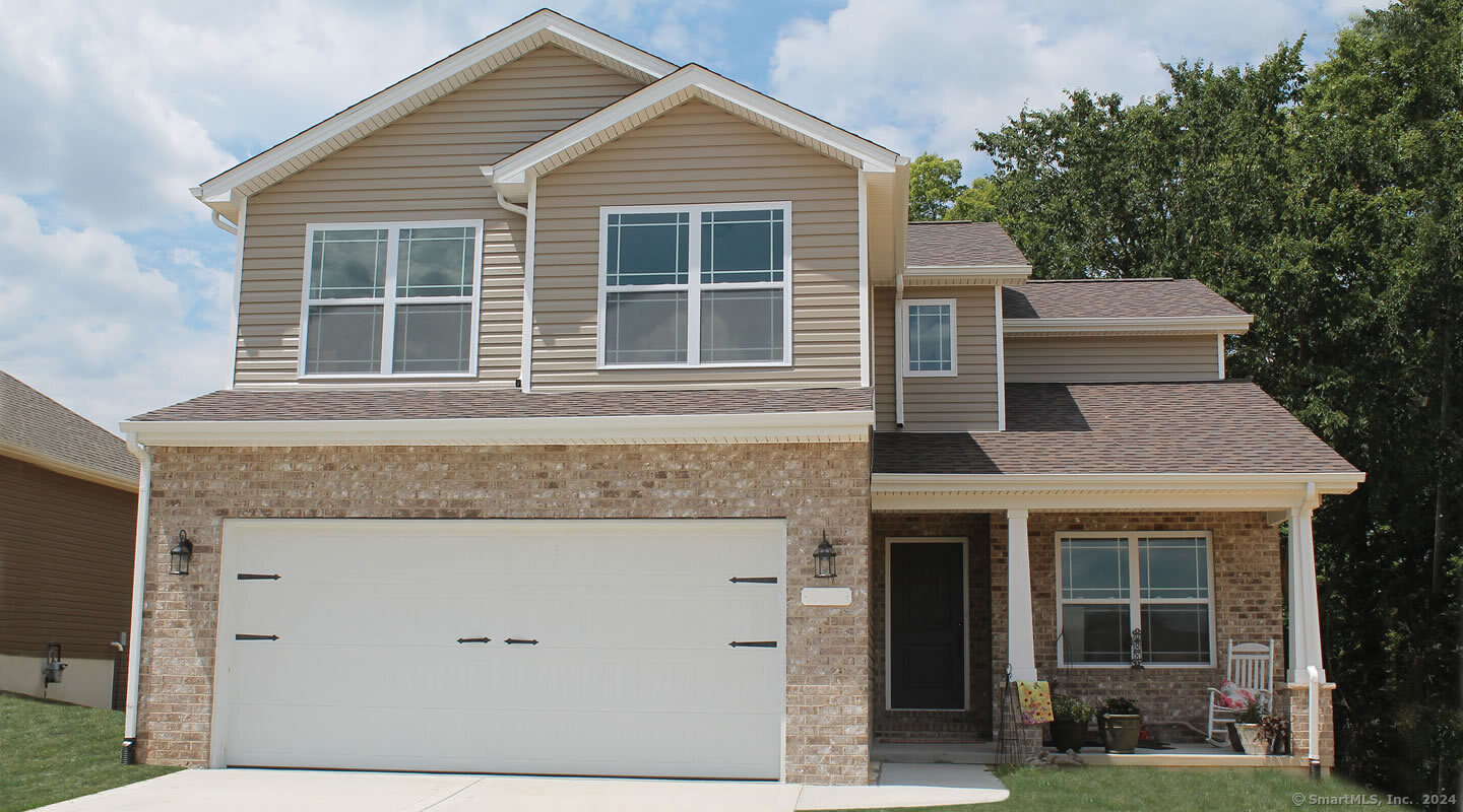 front view of a house and a yard