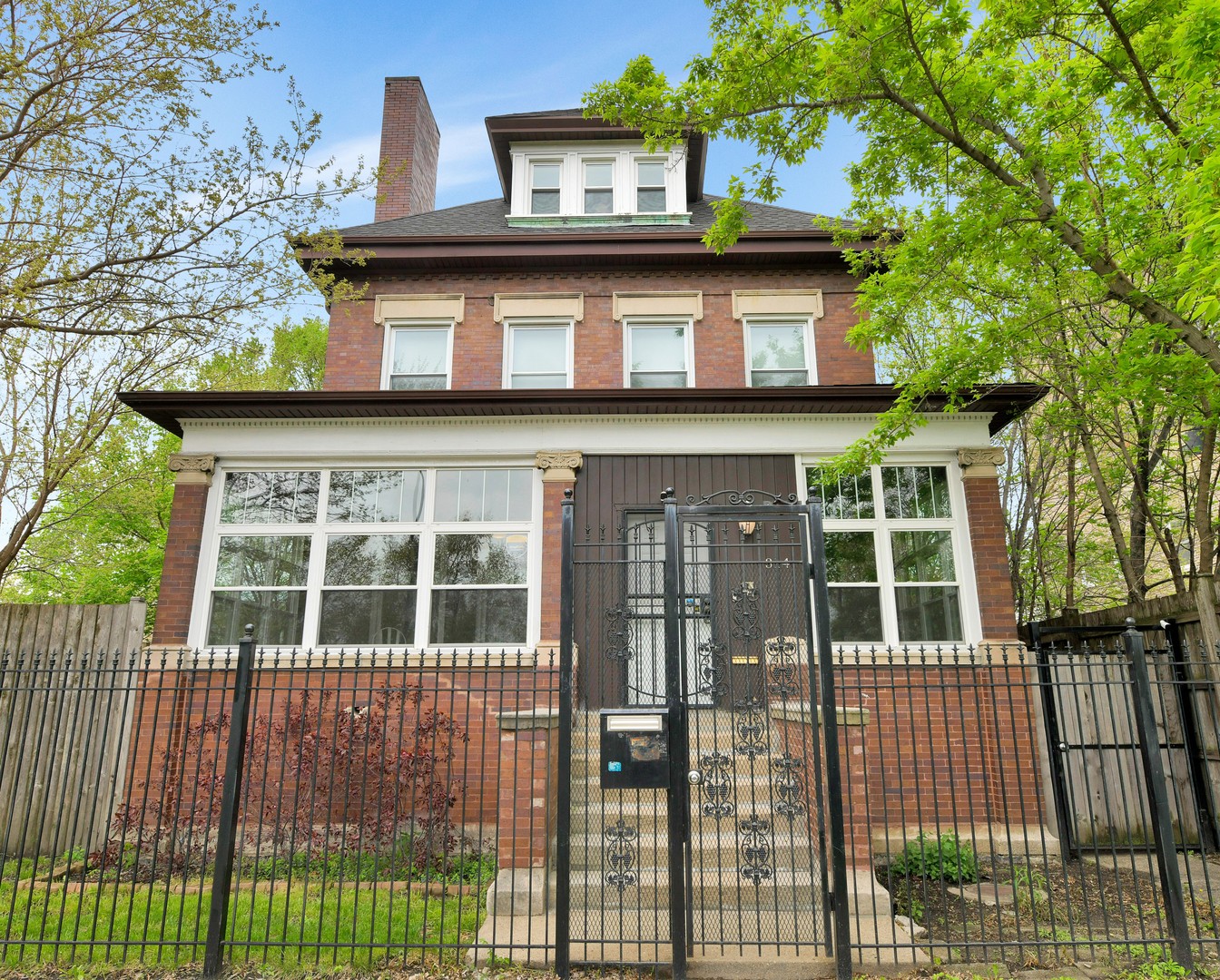 a view of a house with a iron gate