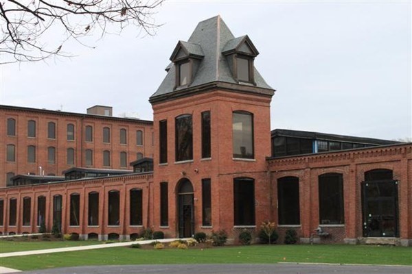 a view of a building with a yard