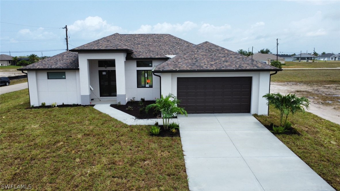 a front view of a house with garden