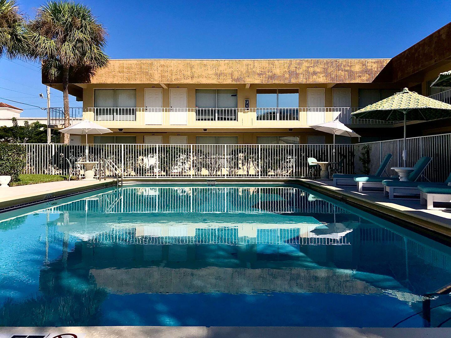 a view of a swimming pool with a patio